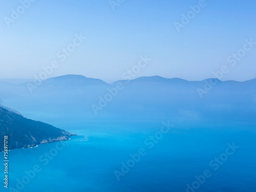 Sea, sky and mountain in the misty cloud blue landscape photo