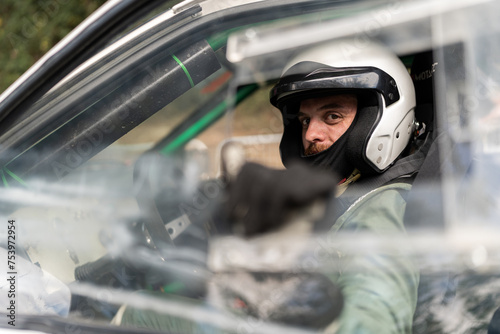 Rally driver with helmet. photo