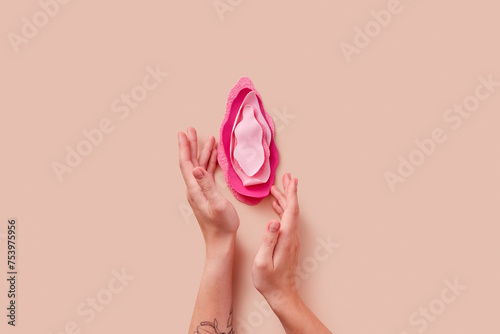 Woman's hands touching vulva made of polyurethane texture materials