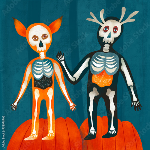 Children in halloween costumes of fox and deer skeletons stand o photo