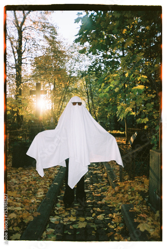 Cute ghost posing at the cemetery