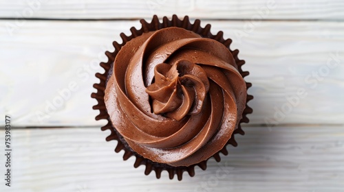 chocolate cupcake with chocolate butter cream swirl on white wooden background,
