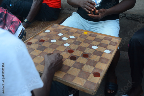 Men playing a board game photo