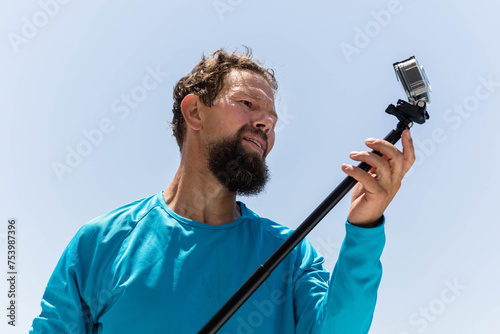 Man with underwater camera photo
