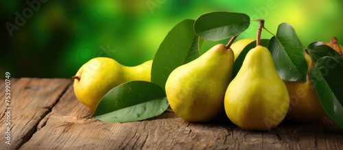 A group of organic pears sitting neatly on top of a wooden table, showcasing their natural colors and shapes. The combination of the vibrant fruits and rustic surface creates a simple yet visually