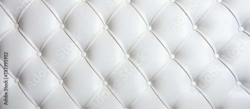This close-up shows the detailed texture of a white upholstered mattress, highlighting its softness and comfort. The clean, bright surface invites relaxation and rest.
