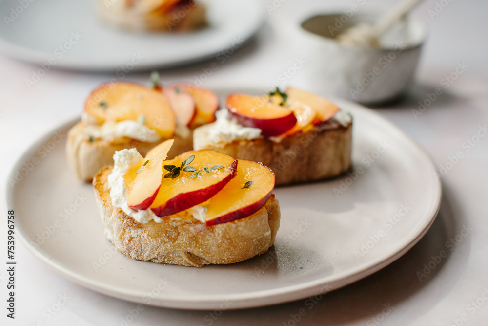 A light meal of plums, cream cheese and honey on toast. A light meal of plums, cream cheese and honey on toast.