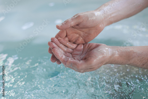 Cupped Hands Collecting Thermal Spa Water