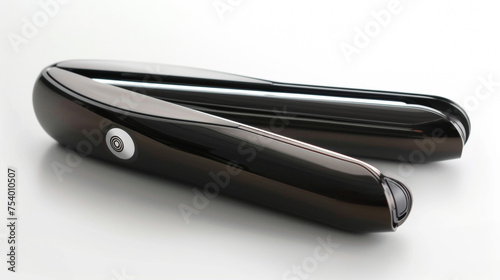 The sleek compact design of a travelsize hair straightener perfect for touchups on the go. photo