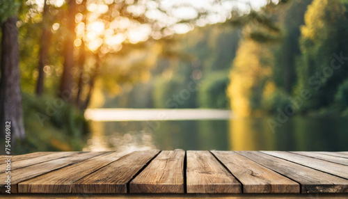 Empty wooden table against blurred nature backdrop, depicting serene evening ambiance