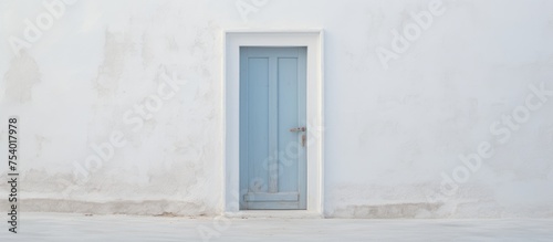 A white building stands with a prominent blue door and window, adding a pop of color to the structure.