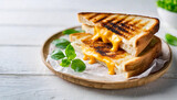 Grilled cheese sandwich on white table, symbolizing comfort, nostalgia, and indulgence, with caption space for advertising or promotion
