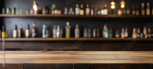 Rustic empty wooden table top of bar counter liquor store with copy space for your decoration. Vintage pub interior, Restaurant space. Abstract blurred bar background for product placement © MadeByAnas