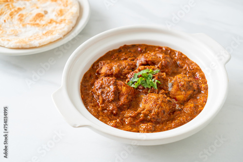 chicken tikka masala spicy curry meat food with roti or naan bread © topntp