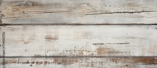 Close-up view of a wooden wall showing signs of weathering, with peeling white paint. The aged wood texture is visible, along with cracks and flaking paint, creating a rustic and worn appearance.