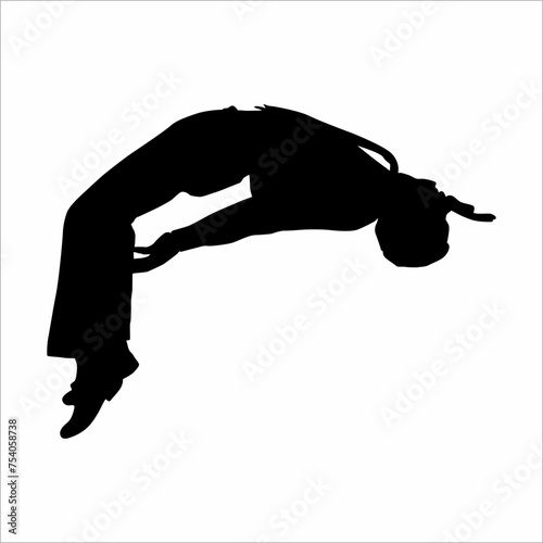 Silhouette of a man doing somersaults in a free style