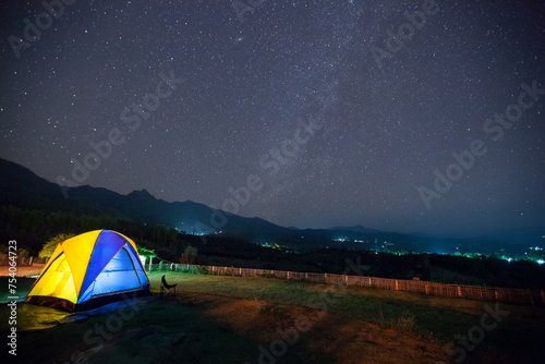 milky way and stars at night sky with camping tent