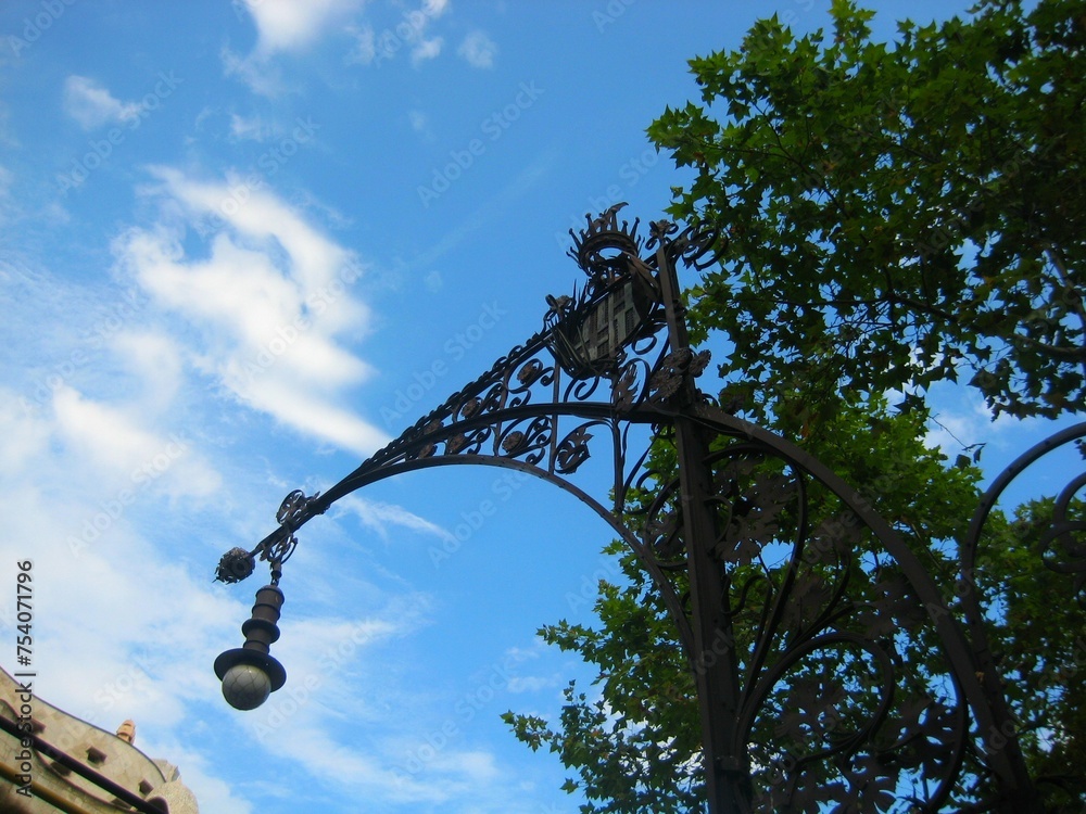 Wall Mural Beautiful street light silhouette and Casa Mila by Antoni Gaudi under the blue s