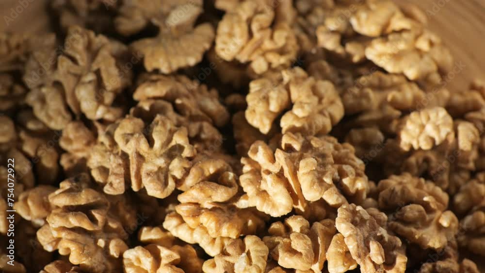 Walnut kernels rotating. walnut close up lies under beams of the sun. Walnut close up. product rich in minerals and vitamins. Macro 4K Walnut kernels rotating. walnut close up lies under beams of the sun. Walnut close up. product rich in minerals and vitamins. Macro 4K