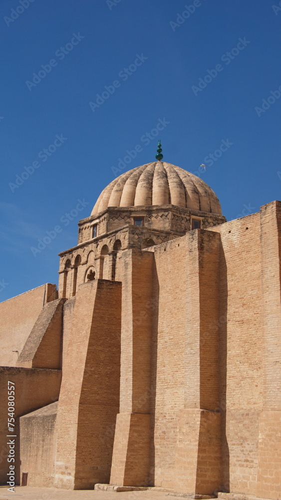 Dome above massive stone walls on the Great Mosque of Kairouan, in Kairouan, Tunisia