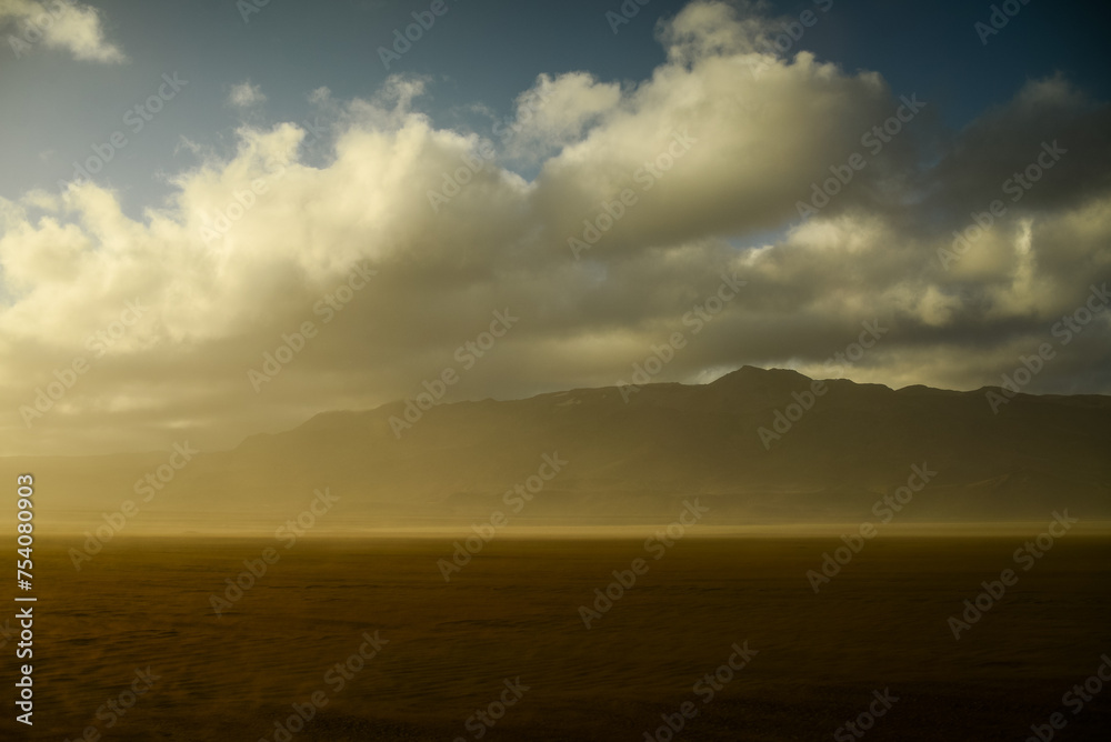 The smoke column of the 2014 Bardarbunga eruption at the Holuhraun volcanic fissures mixes with clouds at sunset during a sandstorm in the remote desert landscape of the Central Highlands, Iceland. The smoke column of the 2014 Bardarbunga eruption at the Holuhraun volcanic fissures mixes with clouds at sunset during a sandstorm in the remote desert landscape of the Central Highlands, Iceland.