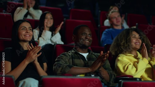 The audience in the cinema liked the film that they enthusiastically applaud after watching it, the audience is inspired and applauds, the focus group applauds the successful ending of the experiment.