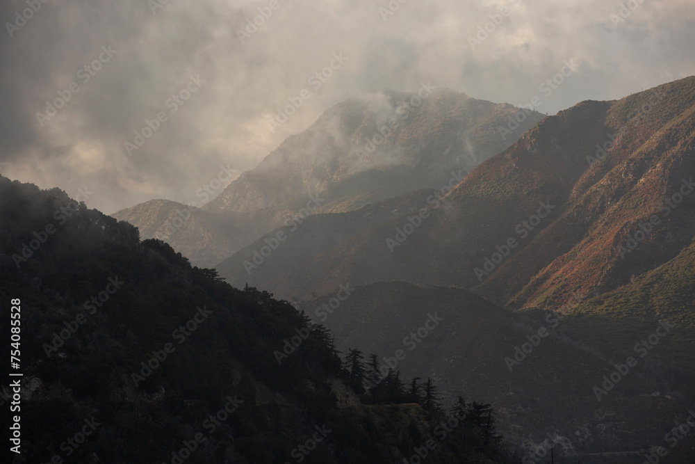 Afternoon fog rolls through the San Gabriel Mountains in Mount Wilson, California, USA.