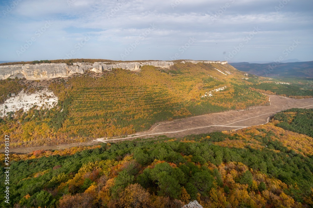 Naklejka premium The autumn landscape of the mountain valley is an amazing, beautiful place at any time of the year. Hiking. Nature