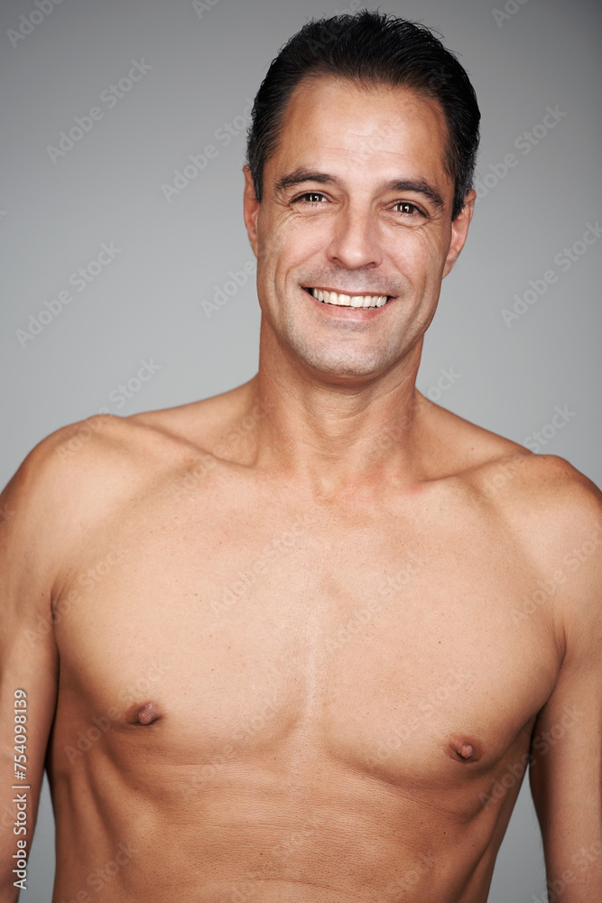 Fototapeta premium Man, shirtless and smile for strength, strong and health for growth and development in body. Mature person and happy with confidence for chest, muscular and masculine for wellness, fit and care