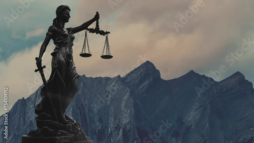 Statue of justice with scales of justice on sunset background. Law and justice concept.