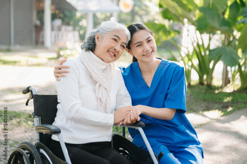 Asian young caregiver nurse support senior older male walking outdoors. Specialis doctor help and take care of elderly mature.