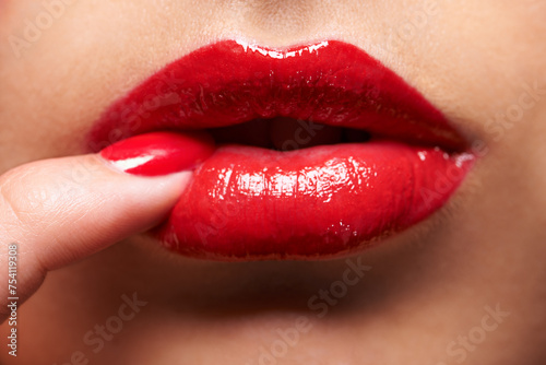 Makeup, red lipstick and closeup of woman lips with trendy, beauty and manicure treatment. Mouth, cosmetics and zoom of female person with gloss for shine and nail polish for cosmetology routine.