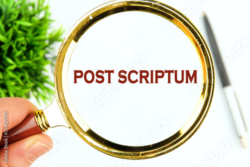 POST SCRIPTUM ancient Latin saying meaning - afterthought, afterwards text through a magnifying glass on a white background photo