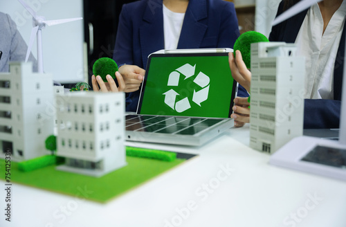 Business tam using tablet for working technology and business, Renewable energy-based green businesses and global warming. Reduce CO2 emission.