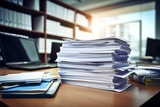 Stack of documents with pc lying on the office desk