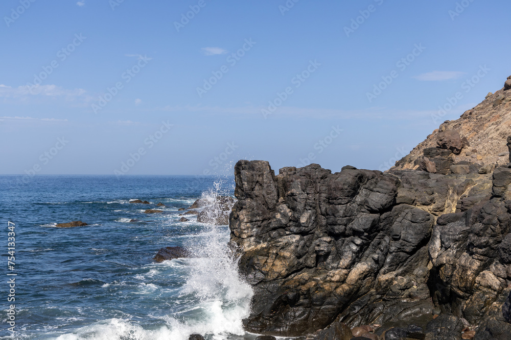 Rock and waves on an empty coast in Gran Canaria, Spain