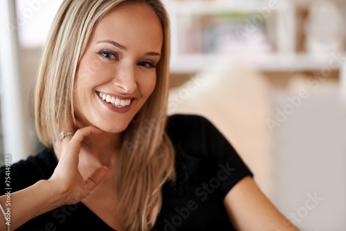 Face, woman and smile in lounge or home for leisure, break and enjoy in couch. Female person, happy and satisfied with comfort or joy in living room, sofa and positivity for self care in house