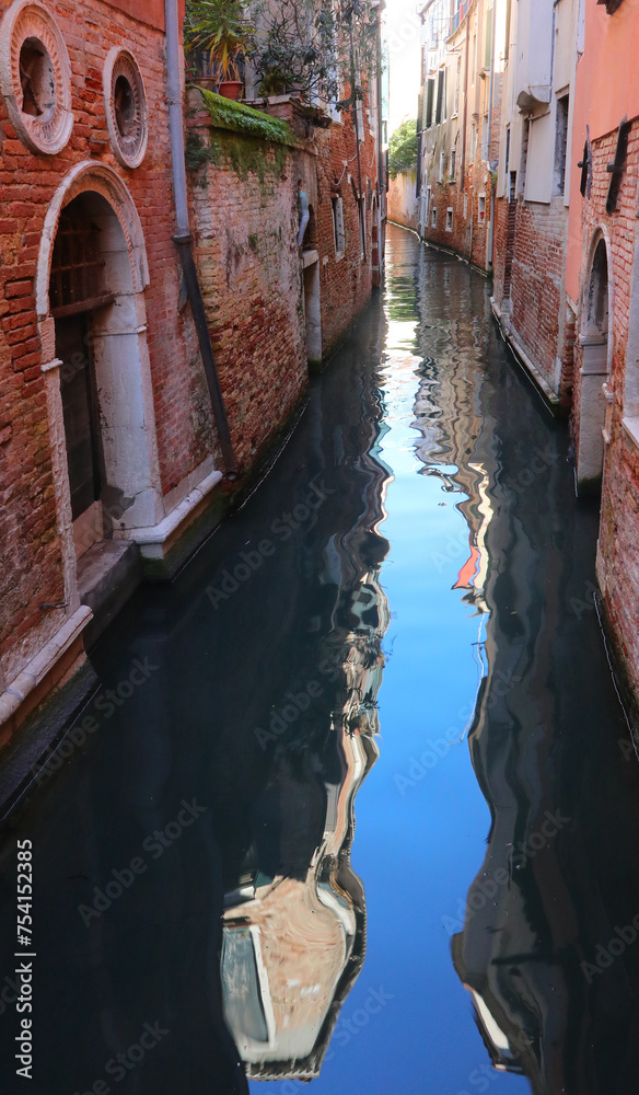 e island of Venice in northern Italy with the navigable canal and the reflection of the houses on the water