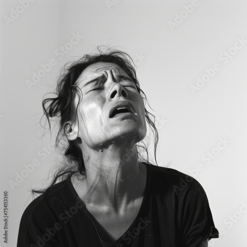 Distressed Crying Young Woman in Emotional Pain photo