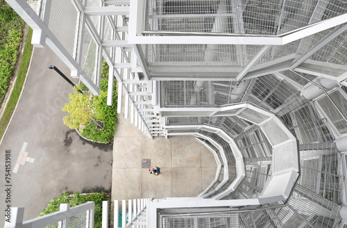 Photography White steel frame structure with surrounding walls are lined with steel grids inside tha Bird Watch Tower at Pupha Mahanatee Garden in Queen Sirikit Park in the centre of Bangkok, Thailand