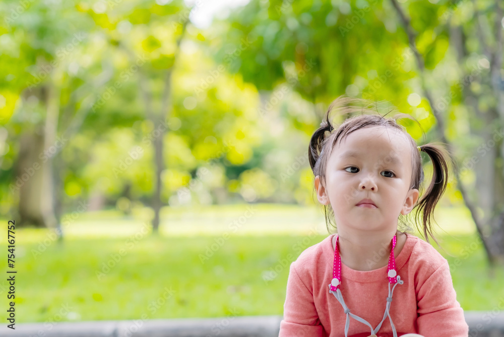 Cute little asian girl wear face mask as protection during the Covid 19 virus outbreak. Copy space. Cute little asian girl wear face mask as protection during the Covid 19 virus outbreak. Copy space.