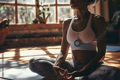  A person practicing yoga in a serene, sunlit room, with a heart monitor device attached to their chest3