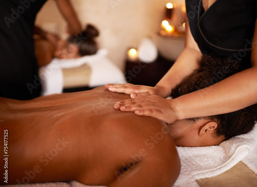 Masseuse, hands and woman on bed with peace, stress relief and luxury wellness at hotel. Physical therapy, relax and zen female client with back massage for vacation, holiday and calm body care