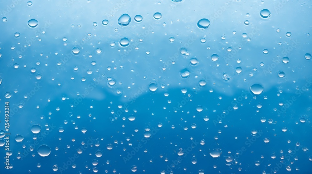 Beaming Water Droplets Luminize on a Sleek Blue Surface 