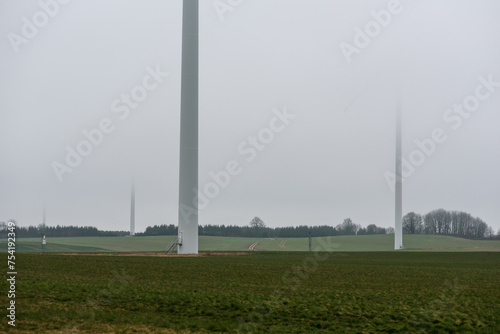 WIND FARM - Wind turbine against the background of a cloudy sky
 photo