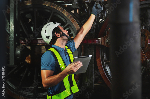 maintenance engineer working operating machines in industry factory