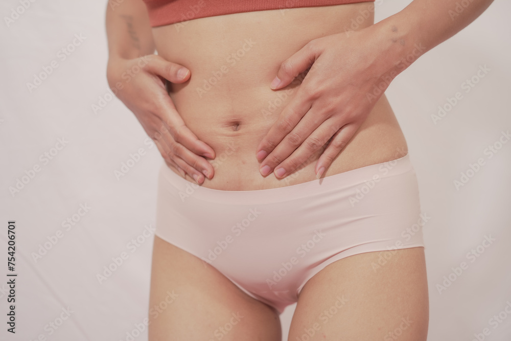 Close-up of woman wearing white panties On a white background about menstruation, cervical cancer, ovarian cancer. Close-up of woman wearing white panties On a white background about menstruation, cervical cancer, ovarian cancer.