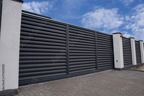 Obraz na plátně Automatic sliding metal gate with shutters