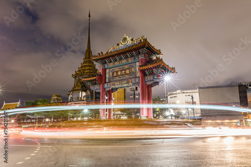 Nighttime traffic at bangkok's iconic royal arch
