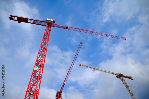 Graceful Cranes Against a Blue Sky: A Symbol of Progress and Growth.